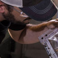 A person inspecting a high-precision aluminum mold